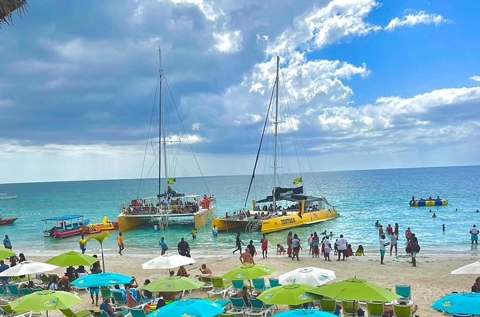 7 Mile Beach Party Catamaran Cruise with Snorkeling & Ricks Cafe - From Montego Bay to Negril: the long ride that shapes the day