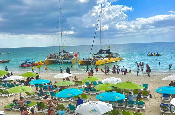 ATV Ride, Negril 7 mile Beach Catamaran Cruise & Ricks cafe Combo - Seven Mile Beach Time: Relaxing After the Dirt, Before the Party Boat
