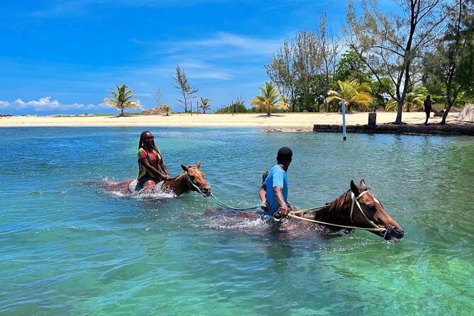 Bamboo Rafting & Horseback Ride n Swim Guided Tour in Montego Bay - Rain happens, and the guides keep things moving