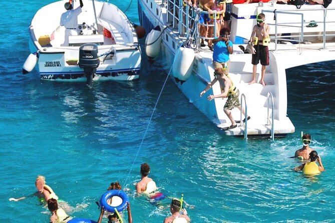 Catamaran Party Cruise and Snorkeling from Montego Bay - Margaritaville stop: 45 minutes with a water slide and inflatables