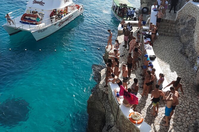 Full Day ATV, Ricks Café, Beach and Shopping Tour from Montego Bay - Ricks Cafe Finale: Party Atmosphere and Cliffside Watching