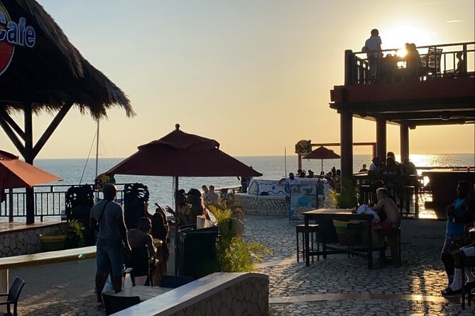 Negril 7 mile Beach, Party Catamaran Cruise , Snorkeling and Ricks Cafe Combo - Rick’s Cafe at sunset: the cliff scene and the DJ energy