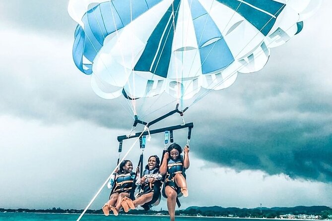 Parasailing, Blue Hole Mineral Spring, Seven Mile Beach - Discovery Bay and Puerto Seco Beach: Shallow-Water Fun for Families
