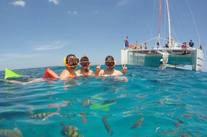 Party Catamaran Cruise with Open Bar and Snorkeling Montego Bay - Getting On Board: Rapsody Tours, Charters, and Your First Stop