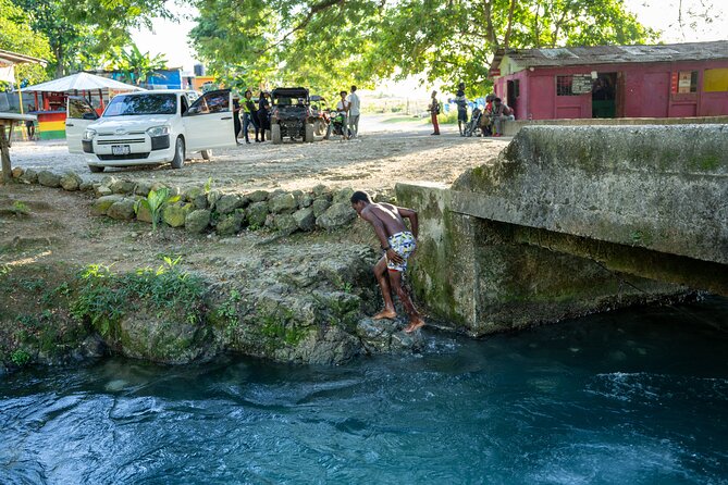 Private Rasta Safari Cultural UTV Village Experience - Entering Roaring River on a side by side ATV