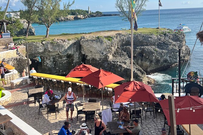 Private Tour for Negril Seven Miles Beach & Rick's Cafe Jamaica - Rick’s Cafe with admission included: cliff-side views and timed show energy