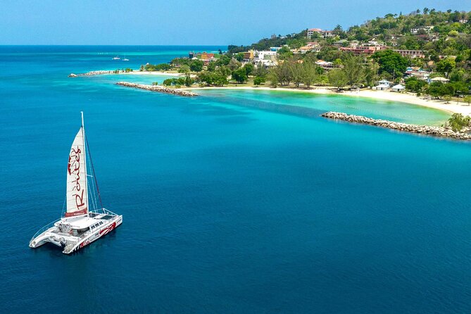 Reggae Catamaran and Snorkeling Open Bar Cruise Montego Bay - Doctor’s Cave Beach snorkeling stop: short, fun, and practical