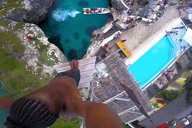 Rick's Cafe and 7 Mile Beach from Montego Bay - Stop 1 at Rick’s Cafe: Sunset Energy, Reggae Music, and Cliff-Jumping Shows