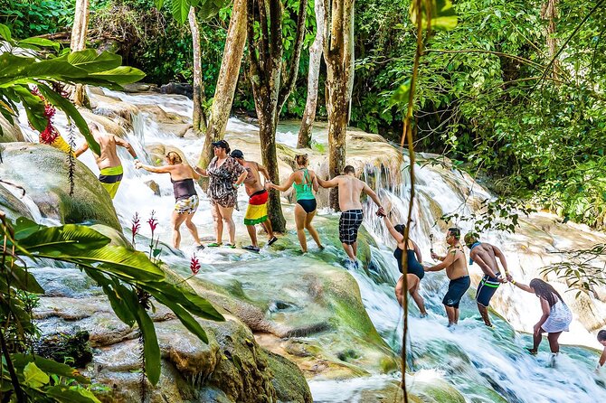Zipline, Dunn’s River Falls, Bamboo Rafting & Horseback Ride Tour - Ziplining over waterfalls: your adrenaline hit right after the climb